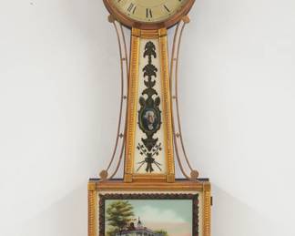 A mid 19th century Boston Banjo clock. 8-day weight driven time only movement with painted Iron dial with Roman numerals marked "A. Willard, Boston". Mahogany case with gilded finish features a turned finial over a molded Brass dial door, tapered throat panel with reverse painted glass flanked by scrolled Brass side arms over a lower door with a reverse painted Naval Battle scene. Restored gilding with minor wear, dial wear, replaced finial and weight, touch-ups to lower glass, running when cataloged. 30" high overall. ESTIMATE $800-1,200