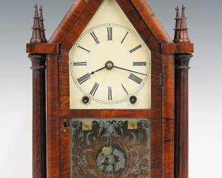 A mid 19th century Brewster & Ingrahams Steeple clock, retailed by Daniel Pratt & Son. 8-day time and strike movement with painted metal dial and Roman numerals. Mahogany four column steeple case with single door, shaped dial glass and frosted lower glass. Paper label inside back 50% intact. Older refinishing with some wear, dial wear, wear to lower glass, small flakes to finials, running when cataloged. 19 1/4" high. ESTIMATE $300-400