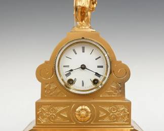 A late 19th century Seth Thomas Sons & Co. figural mantel clock.  8-day time and strike movement with porcelain dial and Roman numerals.  Spelter case with Shepherd boy figure, shaped case and a plinth base with bracket feet.  Re-painted finish with minor wear, dial chip and hairlines, running when cataloged.  14 1/2" high.  ESTIMATE $150-250