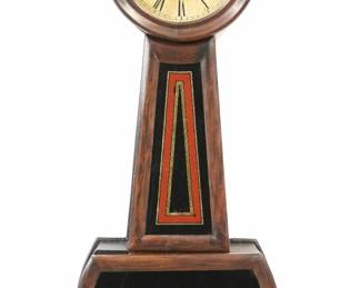 A 19th century Howard No. 5 model Banjo clock.  8-day weight driven time only movement with a painted metal dial and Roman numerals marked "E. Howard & Co., Boston".  Shaped Walnut case with Rosewood grain paint, reverse painted throat and lower door glass.  Older finish with some wear, dial wear and discoloration, running when cataloged.  29" high overall.  ESTIMATE $300-400