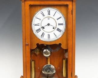 A late 19th century Seth Thomas Lincoln model shelf clock.  8-day weight driven time and strike movement with papered metal dial and Roman numerals, damascened pendulum.  Ash case with molded top over a single long door and molded base with carved scrolls.  Older finish with minor wear, restored dial, running when cataloged.  27 1/2" high.  ESTIMATE $300-500