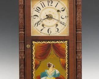 An early 19th century Boardman & Wells Column & Crest shelf clock.  30-hr wooden plate time, strike and alarm movement with painted wooden dial, Arabic numerals and floral detail.  Mahogany case with a carved Eagle crest over a single door with clear dial glass and reverse painted lower flanked by carved pilasters all supported by carved paw feet.  Interior paper label 60% intact.  Refinished with minor wear, restored lower door glass, running when cataloged.  34" high.  ESTIMATE $200-300