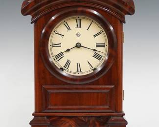 A late 19th century Seth Thomas Arch Top shelf clock.  8-day spring driven time and strike movement with painted metal dial and Roman numerals.  Figured Mahogany case with a single door and clear dial glass on a stepped molded base.  Interior paper label 80% intact.  Refinished with slight wear, re-painted dial, running when cataloged.  15 1/2" high.  ESTIMATE $100-150