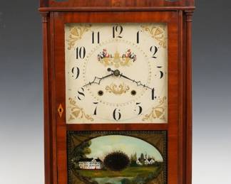 An early 19th century Eli Terry Pillar and Scroll shelf clock. 30-hr weight driven time and strike wooden plate movement with painted wooden dial and Arabic numerals. Mahogany case with scrolled swan neck crest and wood finials above a single door with square dial glass and reverse painted lower with gilded detail, flanked by delicate turned columns on a molded base with scrolled cutout and tall tapering feet. Paper label 50% intact. Older refinishing with good color, slight dial wear, older replaced wooden finials, minor veneer repair on door, running when cataloged. 30 3/4" high overall. ESTIMATE $600-800