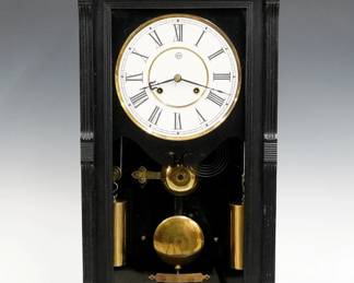 A late 19th century Seth Thomas Garfield model shelf clock.  8-day weight driven time and strike movement with painted metal dial and Roman numerals, damascened pendulum.  Ebonized case with arcaded top over a molded door with fluted pilasters and molded base.  Paper label inside back 90% intact.  Old finish with minor wear, restored dial, running when cataloged.  29 1/4" high.  ESTIMATE $600-800