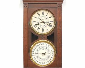 A late 19th century New Haven/Jerome Dneister model wall clock.  8-day spring driven time and strike movement with papered metal dials the upper day of the week indicator and  lower "B. B. Lewis" perpetual calendar movement indicates date and month, with Roman/Arabic numerals.  Walnut case with carved detail features a shaped crest over a single long door over a detachable lower drop, can be used as a shelf model.  Older refinishing with some wear, staining on drop, running when cataloged.  36 1/2" high.  ESTIMATE $300-400