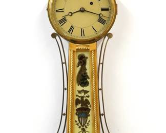A mid 19th century American Banjo wall clock.  8-day weight driven  time only movement with painted Iron dial and Roman numerals.  Mahogany case with a Brass finial over a molded Brass dial door, tapered throat panel with applied rope moldings and reverse painted glass flanked by shaped Brass side arms, lower door with a reverse painted interior scene glass by Tom Moberg.  Refinished with some wear, restored dial and lower glass, replaced finial, running when cataloged.  35" high overall.  ESTIMATE $800-1,200