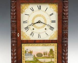 An early 19th century Eli Terry & Sons Column & Splat shelf clock, retailed by George Mitchell, Bristol, CT. 30-hr wooden plate time and strike movement, painted wooden dial with Roman numerals and floral detail. Mahogany case with a carved cornucopia crest flanked by Pineapple finials over a single door with clear dial glass and reverse painted lower flanked by carved pilasters all supported by carved paw feet. Interior paper label 60% intact. Refinished with minor wear, slight flaking on lower door glass, running when cataloged. 29 1/2" high. ESTIMATE $400-600