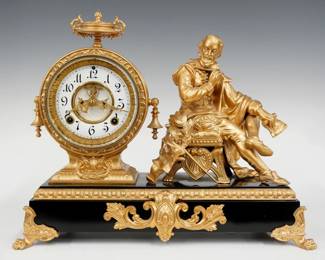 A late 19th century Ansonia Shakespeare model figural mantel clock.  8-day time and strike movement with visible escapement and two part porcelain dial with Arabic numerals, fancy filigree hands.  Black enameled iron base with cast Spelter figure, case, molding and feet.  Refinished with minor wear, running when cataloged.  14 1/4" high overall.  ESTIMATE $300-400