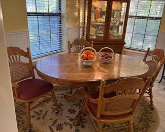 Round Oak Table with one leaf (shown with leaf insert) & 4 club chairs 