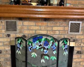 Stain glass fire screen. A few cracked pieces but no missing pieces 