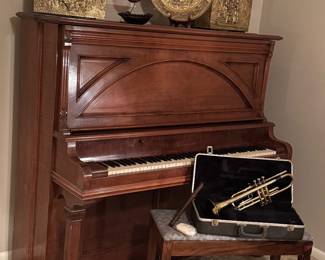 Such a gorgeous upright piano, trumpet