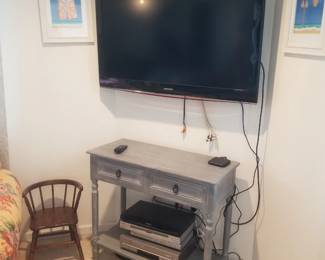 TV with bracket; 2-drawer table; child's chair