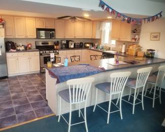 Large kitchen with plenty of cabinets; 4 bar stools