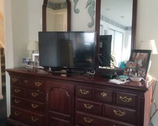 Long dresser with two attached mirrors matches armoire
