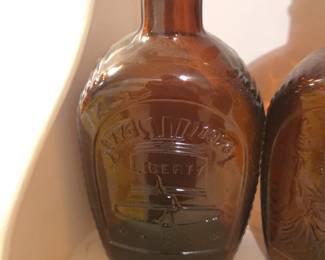 Log Cabin Bicentennial Amber Glass Bottle