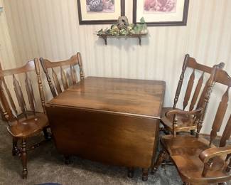 Gate leg drop leaf table with two leaves and four chairs