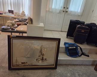 Wall art and luggage