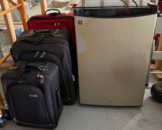 Luggage and small fridge