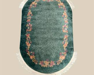 Unique oval rug in soothing green tones with delicate floral accents. Perfect for bedrooms, sitting areas, entryways, or beneath a small table.