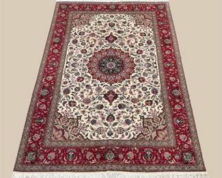 Classic red and ivory medallion rug with finely detailed floral borders.