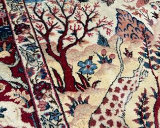 Fine botanical details and graceful branching patterns highlight the remarkable artistry found in this hand-knotted masterpiece.