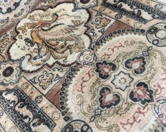 Elegant paisley motifs and flowing floral scrollwork showcase the timeless beauty and craftsmanship of traditional Persian-inspired weaving.
