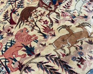 An artistic handmade rug featuring elegant trees, wildlife, and floral elements. A unique conversation piece inspired by traditional Persian garden designs.