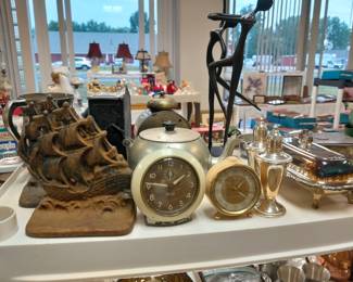 Cast iron book ends, vintage alarm clocks