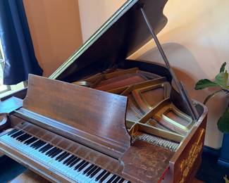 Baby grand piano and bench 