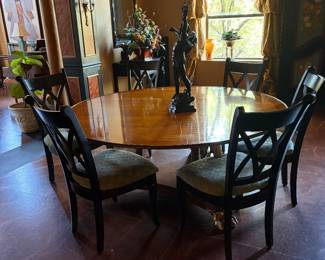 Lovely round dining room table with six chairs