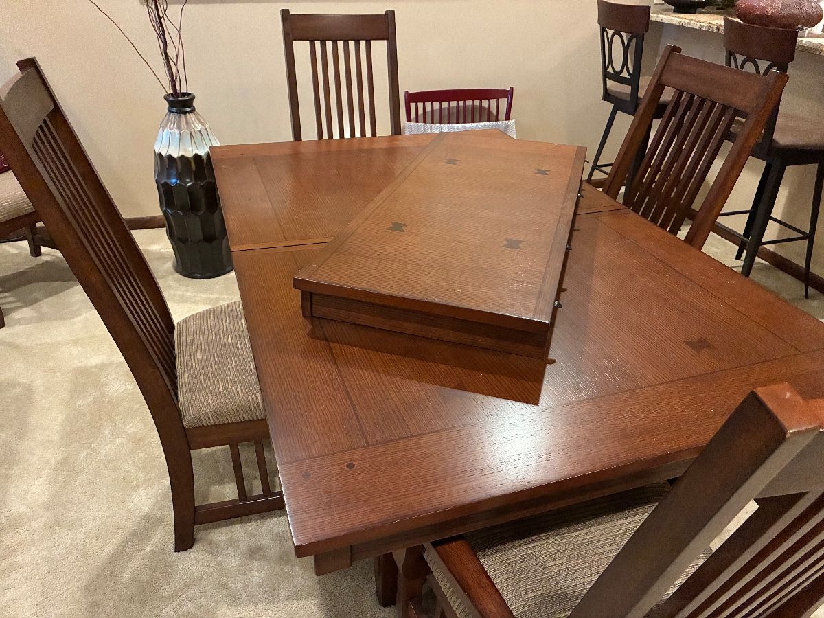 Gorgeous solid wood dining room table with one extra 18” wide leaf and 6 chairs. 42” wide x 70” long and 30” high. Six chairs are included in the package.
