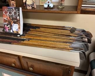 25 very vintage golfing irons and 2 woods, all with wooden shafts (hickory?).