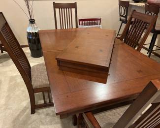 Gorgeous solid wood dining room table with one extra 18” wide leaf and 6 chairs. 42” wide x 70” long and 30” high. Six chairs are included in the package.
