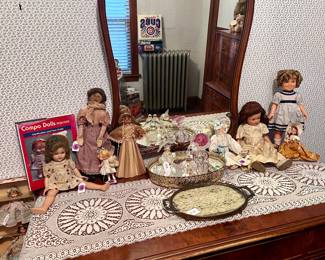 Antique dolls and perfume bottles
