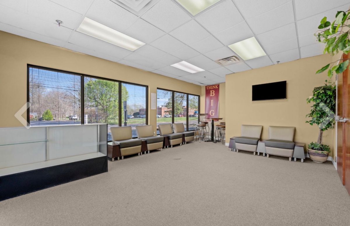 Display case, waiting chairs, high top table 