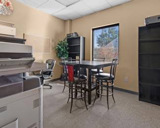 Bookshelves, table and chairs, printer, computer desk