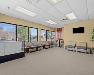 Display case, waiting chairs, high top table 