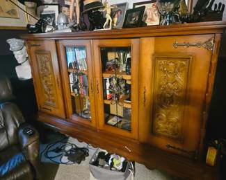 This very old 9 ft long cabinet is located at my house off of Sarno I believe it is from Germany and carved. Is available for purchase $500 I also have the matching smaller cabinet as seen in another photo for $300