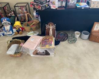 Assorted collectible dolls and bears, baskets, framed décor, decorative storage boxes, household organizers, planters and additional home accessories.