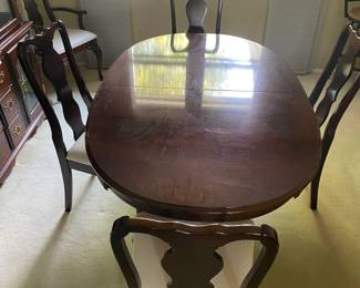 Mahogany pedestal dining table with 6 matching chairs and coordinating china cabinet. Excellent condition.