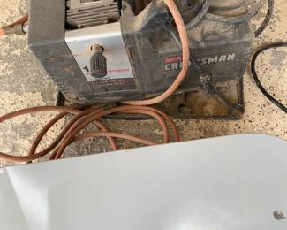 Craftsman air compressor with air hose and adjustable pressure regulator. Great for powering pneumatic tools, inflating tires and general garage or workshop use.