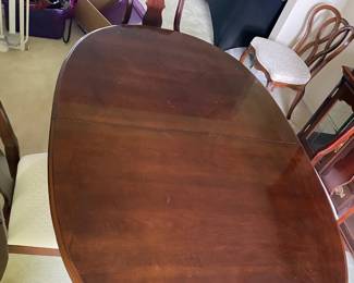 Mahogany pedestal dining table with 6 matching chairs and coordinating china cabinet. Excellent condition.