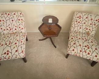 Pair of matching upholstered accent chairs with red berry-and-branch pattern, in excellent condition.