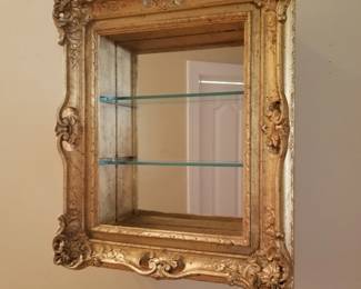 Gold painted curio shelf 