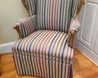 Vintage wingback chair with upholstered skirt