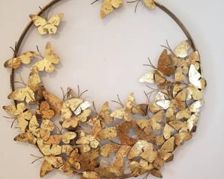 Gold tone metal wall sculpture