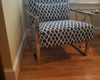 Modern arm chair with gold metal frame. 