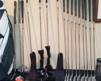Golf clubs, including Titleist, Callaway.