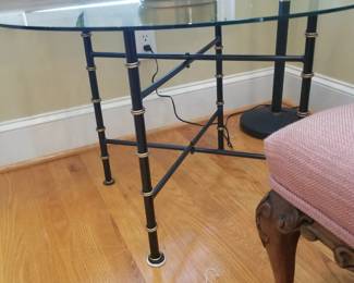 Black and gold painted accent table, with glass top. 